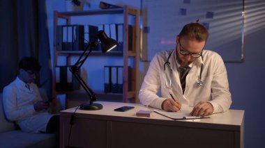 Doctors colleagues in the night shift working in the hospital. Copy space