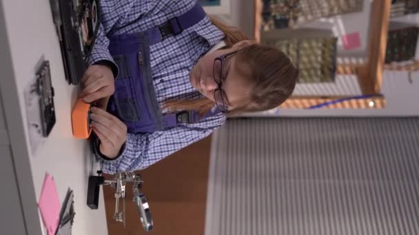 Female Repairman Testing Circuit Board Checking Multimeter Measurements Magnifying Glass — Vídeos de Stock