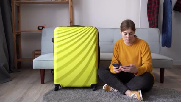 Planning Travel Young Woman Yellow Suitcase Using Smartphone Credit Card — Vídeos de Stock