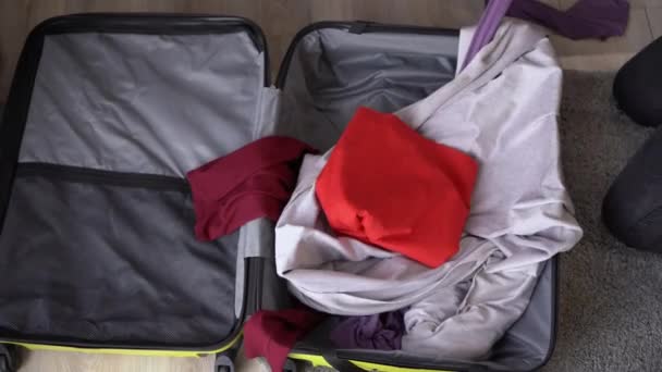 Traveler Packing Suitcase Trip Home Throws Things Clothes Top View — Stockvideo