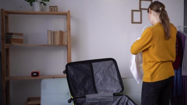 Young Woman Packing Stuff Luggage Sofa Home Travel Preparing Suitcase — Stockvideo