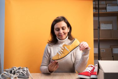 Indian woman taking live selling shoes online, Recording making video blogger camera Start up small business owner e-commerce ideas concept