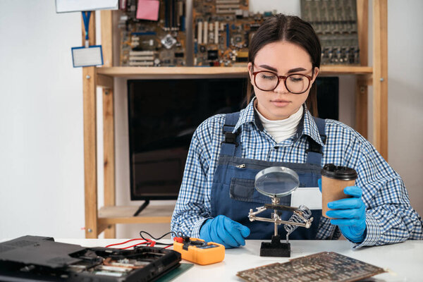Technician repairing computer hardware. Small business owner of a computer repair store. Computer repair concept