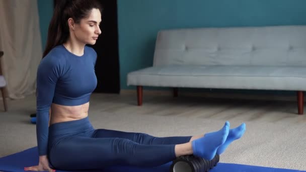 Woman Kneading Fascia Calf Muscle Black Massage Roller Sports Gear — Stock Video