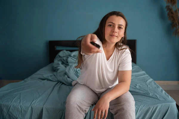 Woman Watches Sitting Bed Using Remote Control Her Hands Morning — Stock Photo, Image