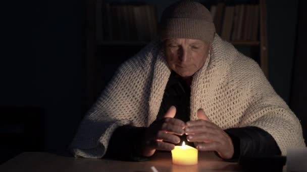 Old Man Hands Home Table Warms His Hands Burning Candle — Stock Video