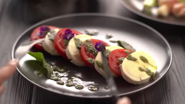 Woman Eating Italian Caprese Salad Sliced Tomatoes Mozzarella Basil Olive — Stock Video