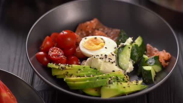 Ketogenic Diet Breakfast Eating Salt Salmon Salad Cucumbers Eggs Avocado — Stock Video