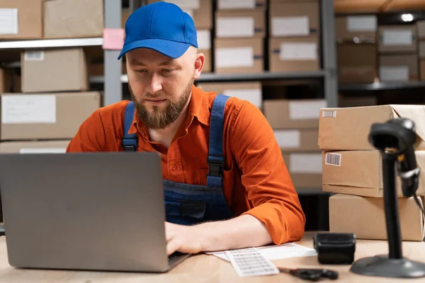 Male Inventory Manager Worker Checks Stock Using Laptop Computer Millennial — Foto de Stock