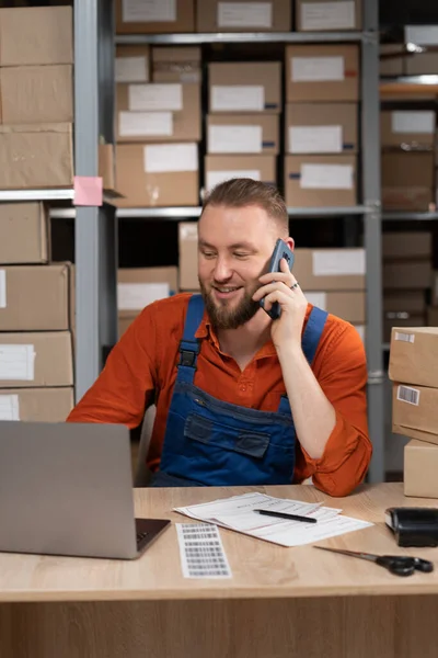 Warehouse Manager Talking Phone While Smiling Sitting Laptop Table Copy — Fotografia de Stock