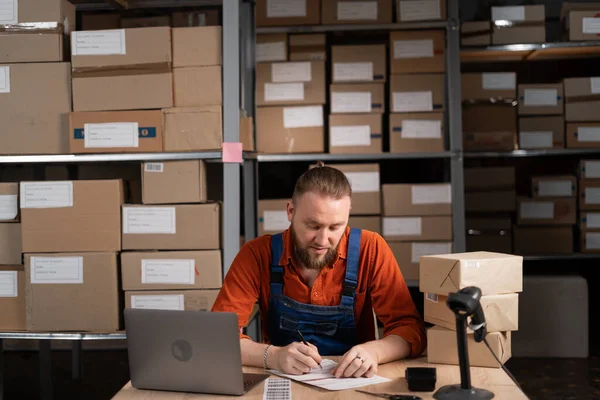 Young Male Small Business Owner Working Retail Warehouse Writing Delivery — Fotografia de Stock