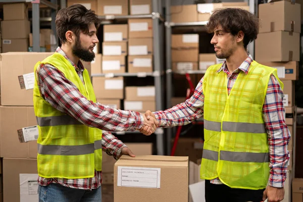Multi Ethnic Male Staff Shaking Hands Each Other Warehouse Working — Stock Photo, Image