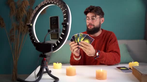 Professional Online Streamer Tells Fortunes Using Tarot Cards Live Using — Stock Video