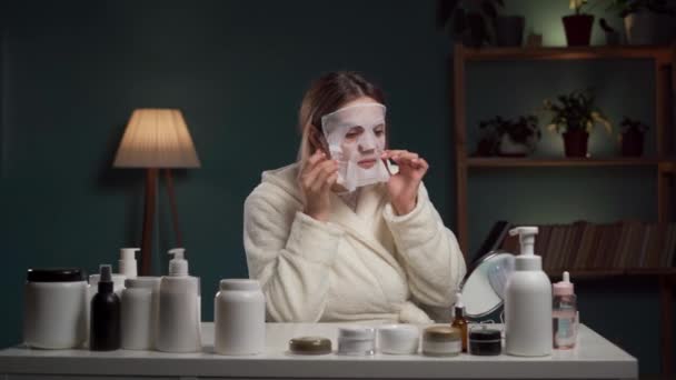 Spa Home Woman Applying Facial Sheet Mask Sitting Evening Her — Stock Video