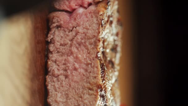 Close Steak Ribeye Cutting Knife Fork Meat Cutting Board Dark — Stock Video