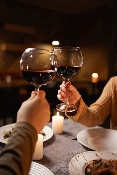 Young Couple Celebrating Valentine Day Restaurant Drinking Red Wine Close Royalty Free Stock Photos