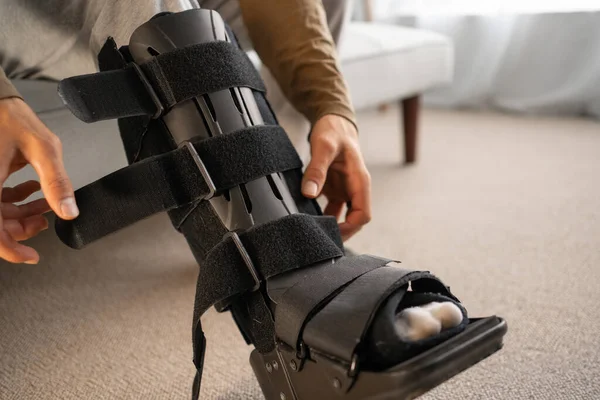 Close Injury Man Black Splint Leg Sitting Sofa Home Wearing Stock Picture