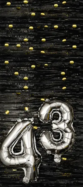 Silver foil balloon number 43 on a background of black tinsel with gold confetti. Birthday card, inscription forty-third. Anniversary event. Vertical banner. copy space.