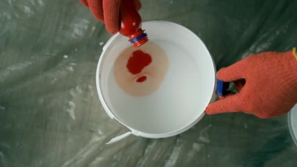 Painter Builder Pours Orange Dye White Paint Bucket Mixing Colors — Stock Video