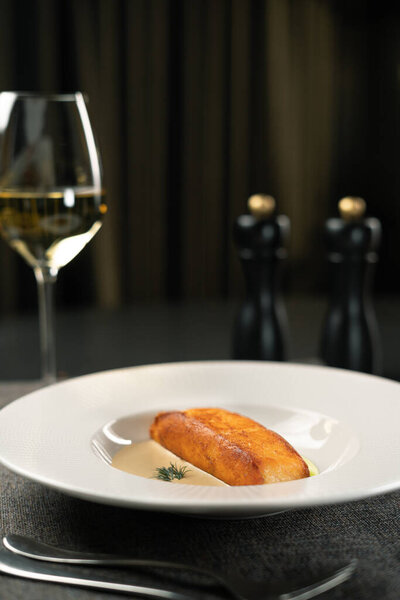 Dinner at the restaurant. Fish menu. Grilled salmon with wine. Copy space