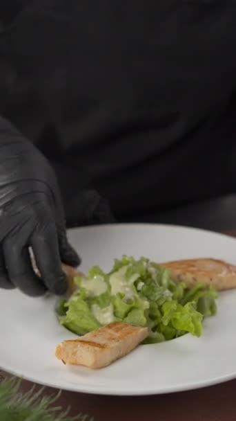 Close Chef Hands Putting Salmon Seafood Plate Lettuce Salad Vertical — Stock Video