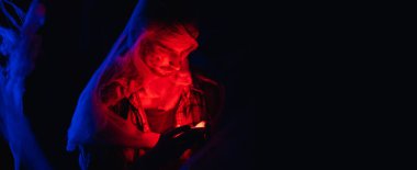 Halloween man zombie in spiderweb. Satan, danger concept. Devil dead man. Banner. Copy space