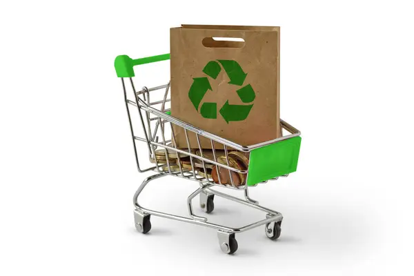 stock image Shopping cart with paper shopping bag with recycle symbol on white background - Ecology concept