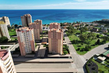 Drone point of view, aerial shot of spanish town of Dehesa de Campoamor during sunny day. Spain