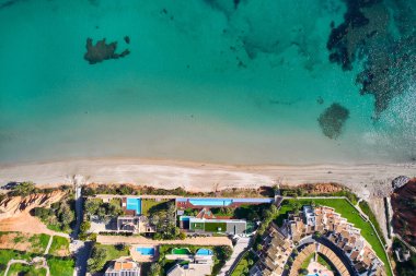 Drone point of view, aerial shot of spanish town of Dehesa de Campoamor during sunny day with Mediterranean Sea view. Costa Blanca, Alicante. Spain