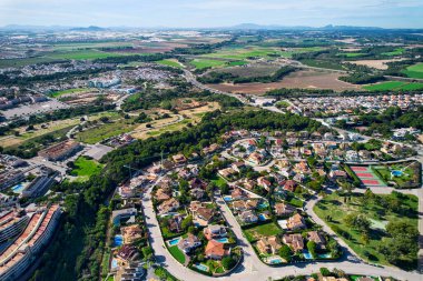 Drone point of view, aerial shot of Dehesa de Campoamor countryside during sunny day. Costa Blanca, Alicante, Spai clipart