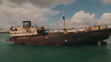 Aerial drone point of view to the abandoned ship after shipwreck on the shore between Arrecife and Costa Teguise of Lanzarote Island. Spain. Travel destinations concept