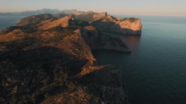 Rocky mountains washed by Mediterranean Sea during sunrise, drone point of view. Formentor, Spanish Island of Majorca or Mallorca, the largest island in the Balearic Islands, Spain