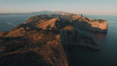 Rocky mountains washed by Mediterranean Sea during sunrise, drone point of view. Formentor, Spanish Island of Majorca or Mallorca, the largest island in the Balearic Islands, Spain