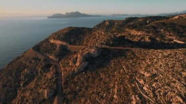 Curved mountain road leads across mountain road, view from above Majorca Island, Balearic Islands. Spain