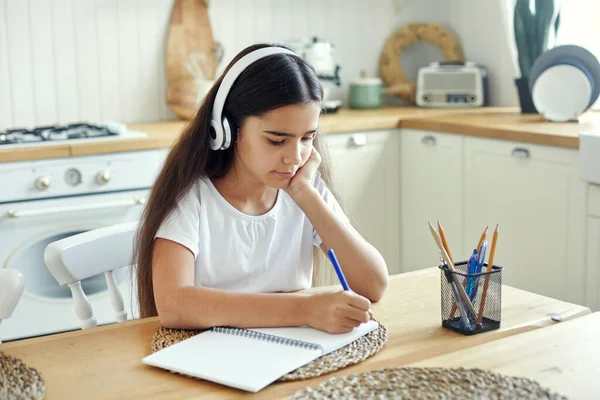 Pretty Pre Teen Girl Wireless Headphones Writing Task Makes Assignment — Stock Photo, Image