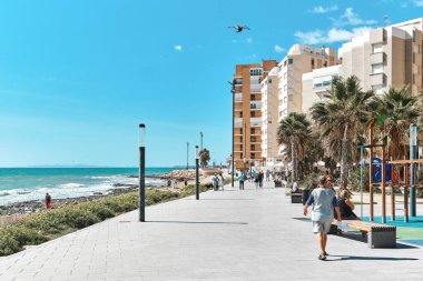 Torrevieja, Spain - September 28, 2024: Scenic view of coastal promenade in Torrevieja near Mediterranean Sea. Touristic places concept