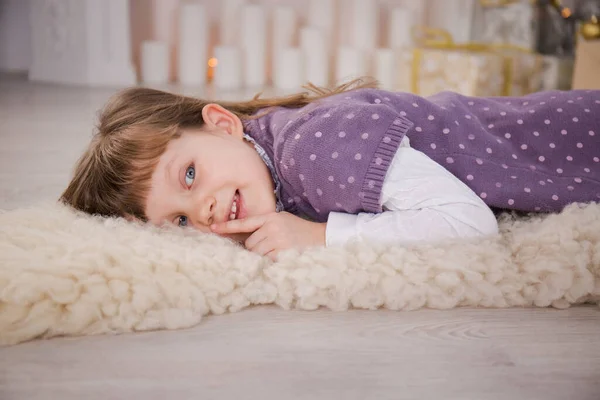 Cute Little Girl Lying Fireplace Fur Blanket — Stock Photo, Image