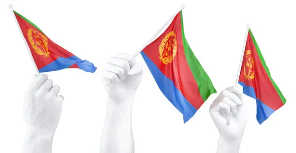 三只孤立的手挥动厄立特里亚国旗 象征着民族自豪和团结 图库照片