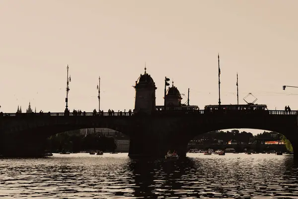 stock image Silhouette of Legion Bridge on Vltava river. Prague, Czech Republic