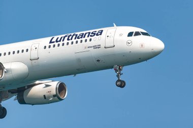 Larnaca, Cyprus - September 3, 2023: Lufthansa Airbus a321 passenger airplane is flying in a clear blue sky clipart