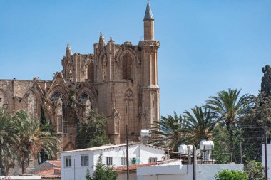 Standing tall above the rooftops of Famagusta, the Lala Mustafa Pasha mosque is a reminder of the city's rich and complex history clipart