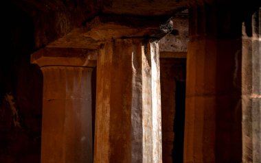 Ancient stone columns and architectural details in historic Tombs of the Kings site. Paphos, Cyprus