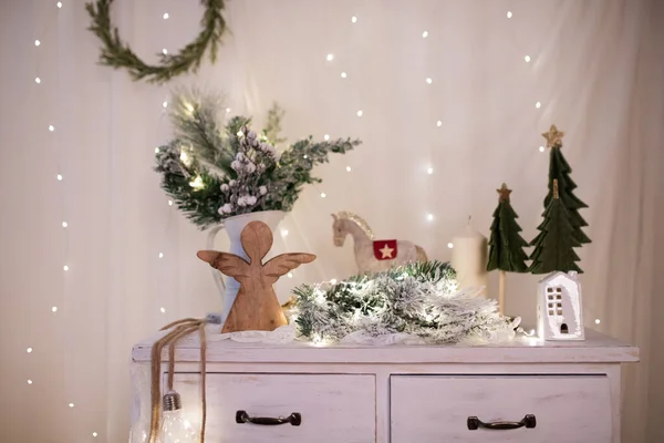Winter, holidays and decoration concept - vintage Christmas decorations over sparkling holiday lights