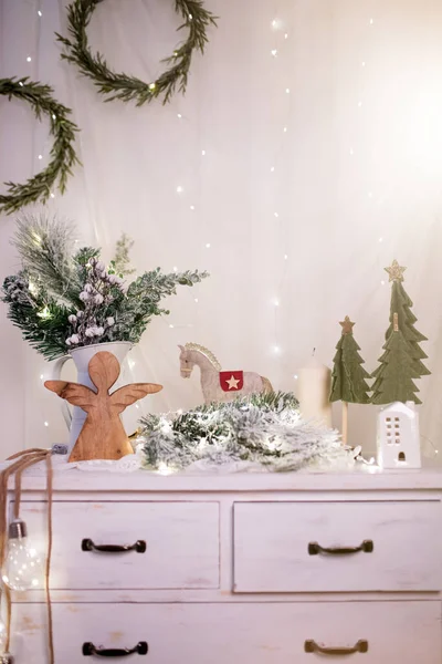 Winter, holidays and decoration concept - vintage Christmas decorations over sparkling holiday lights