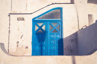 Procida island with colorful houses in small town street