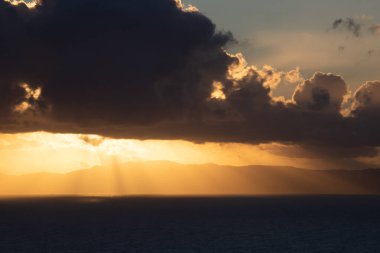 View from Procida island - magic sunrise with dramatic clouds.