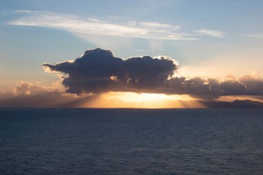 View from Procida island - magic sunrise with dramatic clouds.