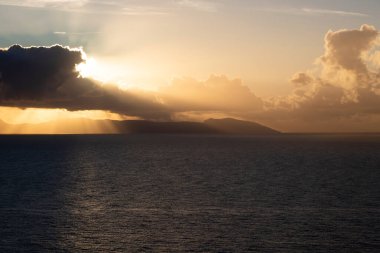 View from Procida island - magic sunrise with dramatic clouds.