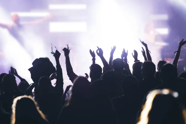 stock image Crowd at concert - Cheering crowd in front of bright colorful stage lights