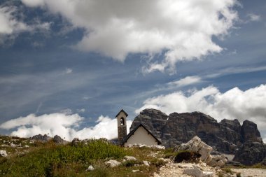Cappella degli Alpini with Dolomites peaks in the background, Tre Cime di Lavaredo, Dolomites, Italy clipart